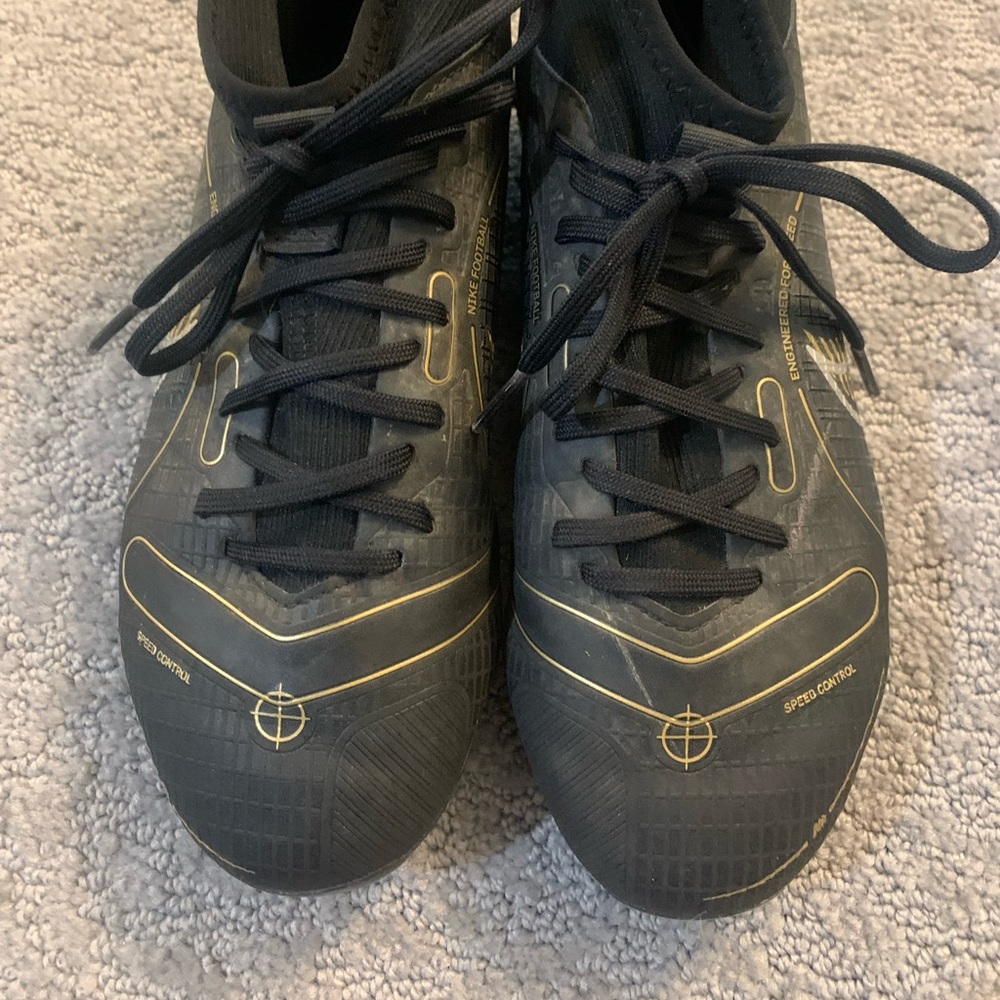 Nike black silver and gold cleats